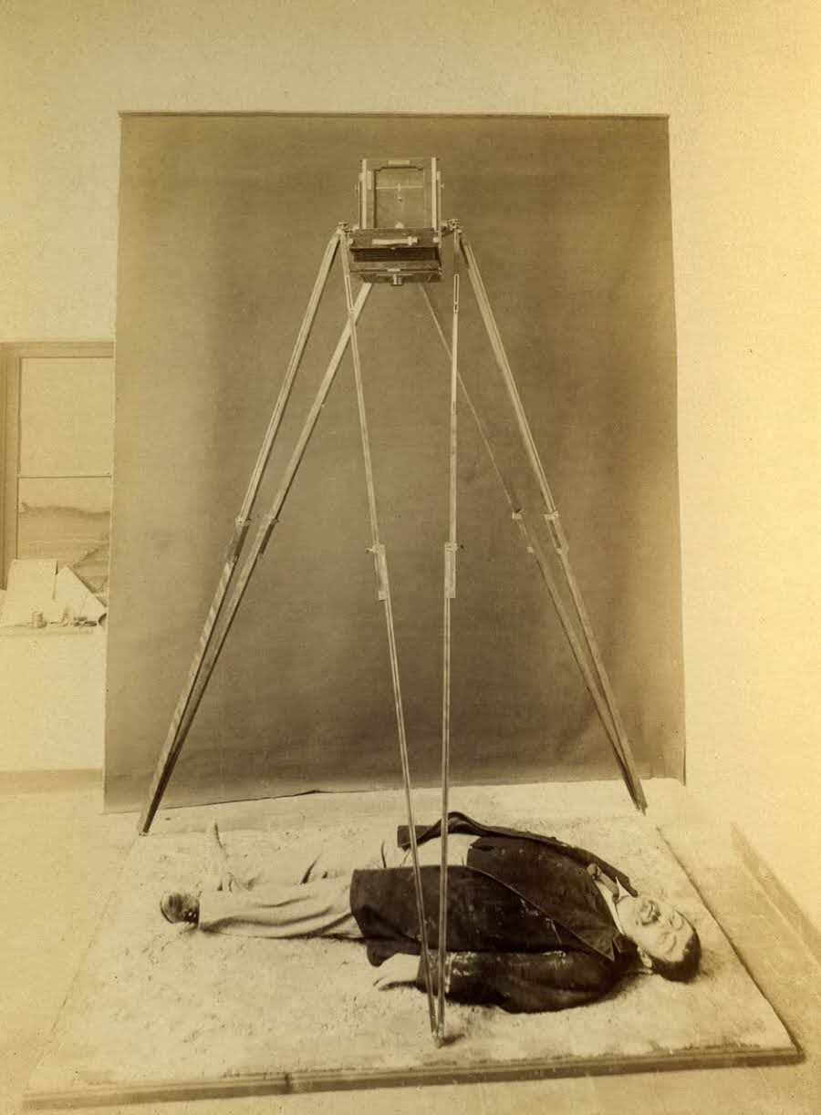 A special tripod arrangement for photographing a murder victim (he is not really dead).