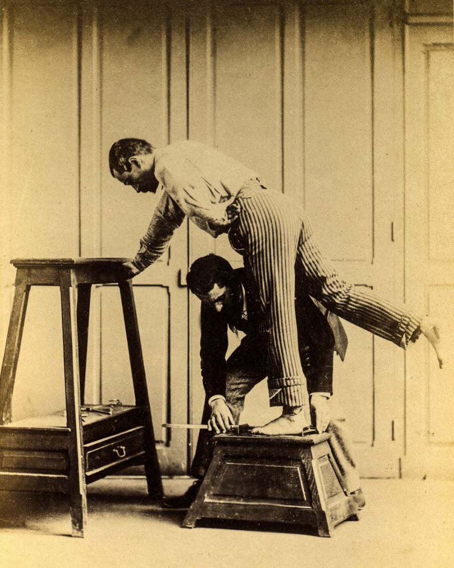 Bertillon measures a subject’s foot.