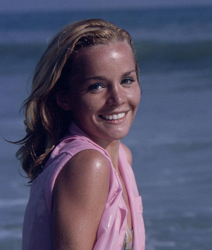 Tuesday Weld as she glaces over her shoulder on a beach, 1963.