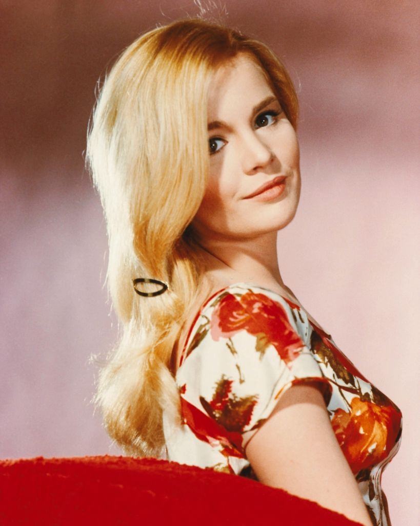 Tuesday Weld wearing a floral print top in a studio portrait, 1965.