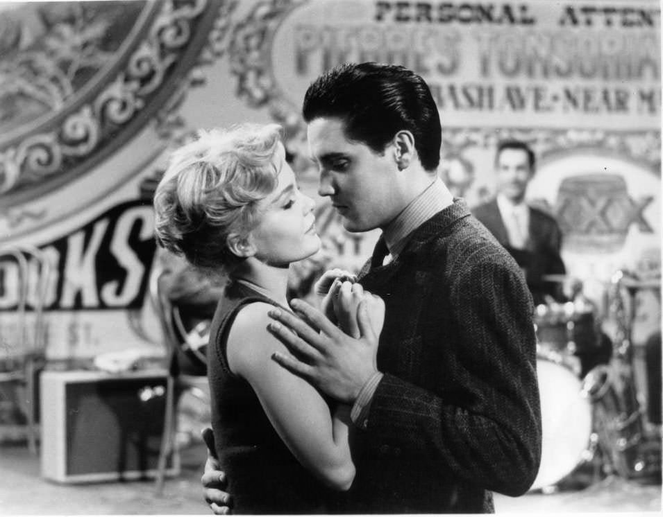 Tuesday Weld and Elvis Presley dance together in a scene from the film 'Wild In The Country', 1961.