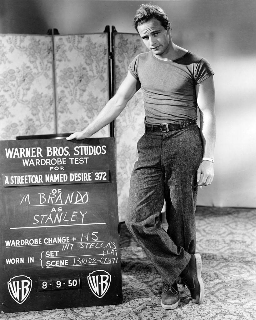Marlon Brando carry out a wardrobe test for his role as Stanley Kowalski in 'A Streetcar Named Desire', 1950.