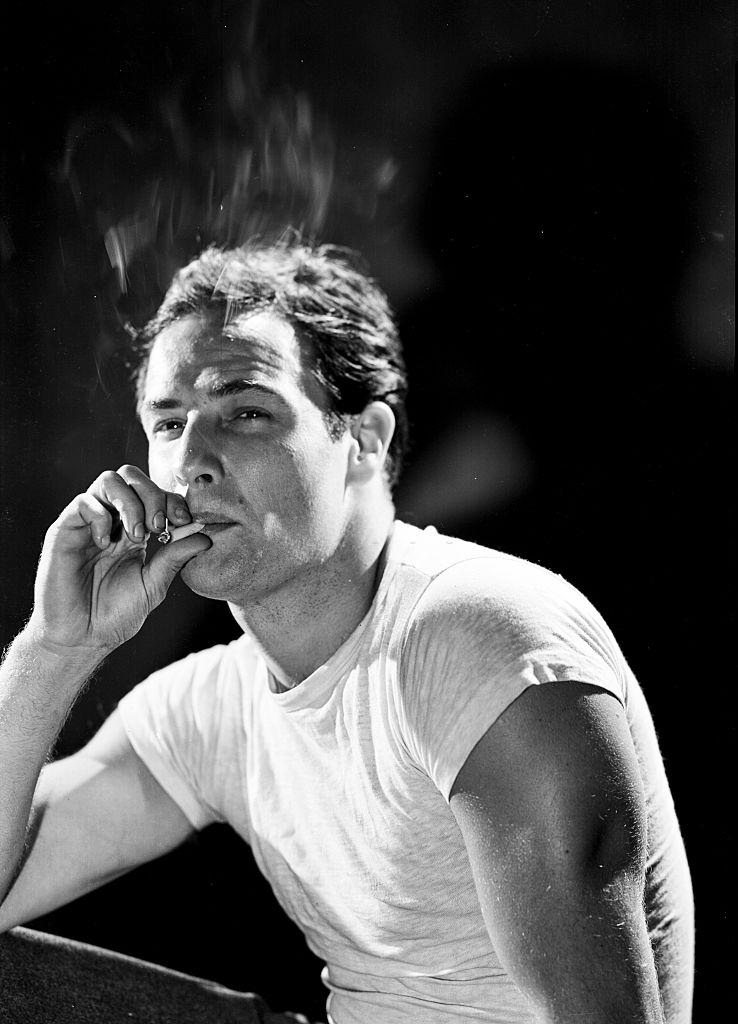 Marlon Brando smoking a cigarette, 1951.