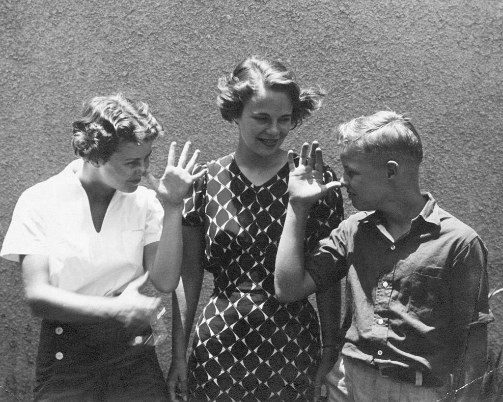 Marlon Brando at age 13 with his siters, 1937.