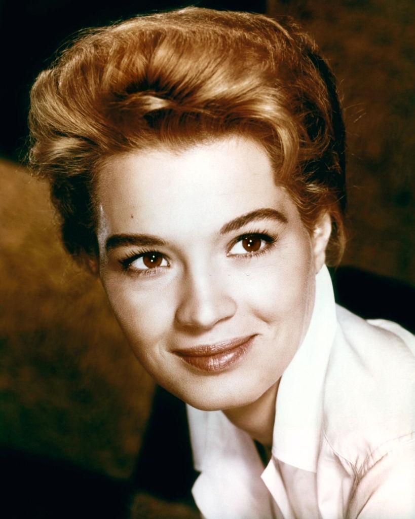 Angie Dickinson wearing a white blouse in a studio portrait, 1960.