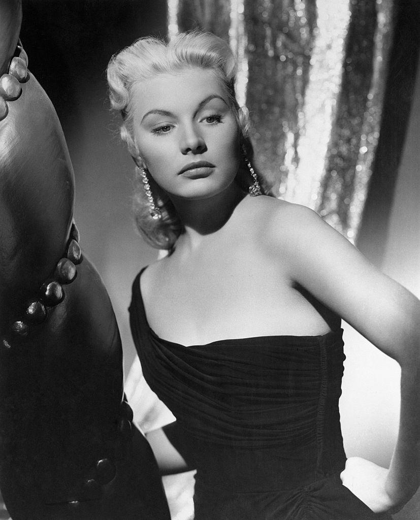 Barbara Payton in black dress, 1949.