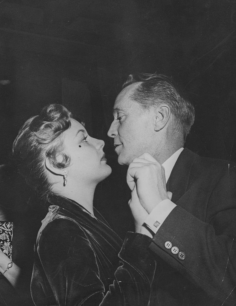 Barbara Payton and Franchot Tone dancing at a night club in Hollywood, 1951.