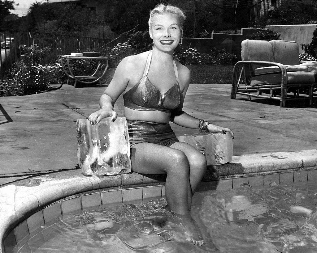 Barbara Payton displaying her charm midst some cooling cubes, 1949