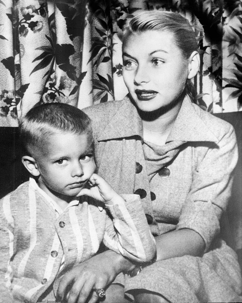 Barbara Payton and her son, Denny, as they arrived in Minneapolis on their way to Cloquet, 1951