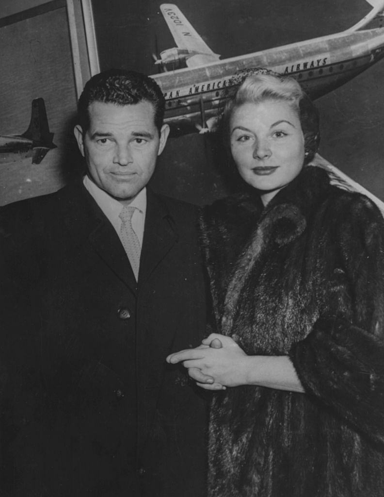 Barbara Payton and Tom Neal pictured on their arrival from England to attend to her son, 1952.