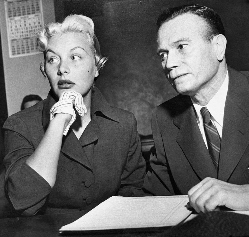 Barbara Payton with her attorney Milton Golden, 1952.