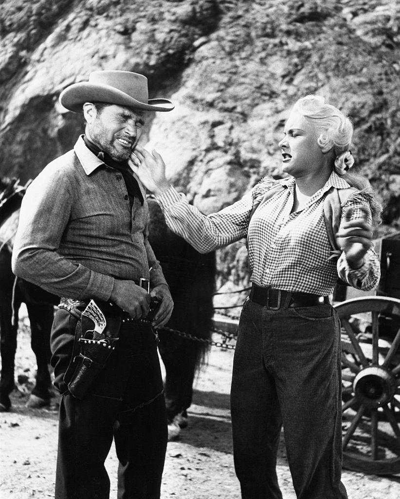 Barbara Payton and Tom Neal in Scenes from 'The Great Jesse James Raid',1953.