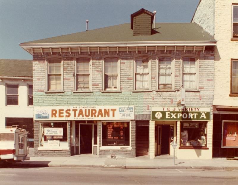 Fish and chip restaurant at 352 Front Street Belleville, and T. and J. Variety store at 356 Front Street