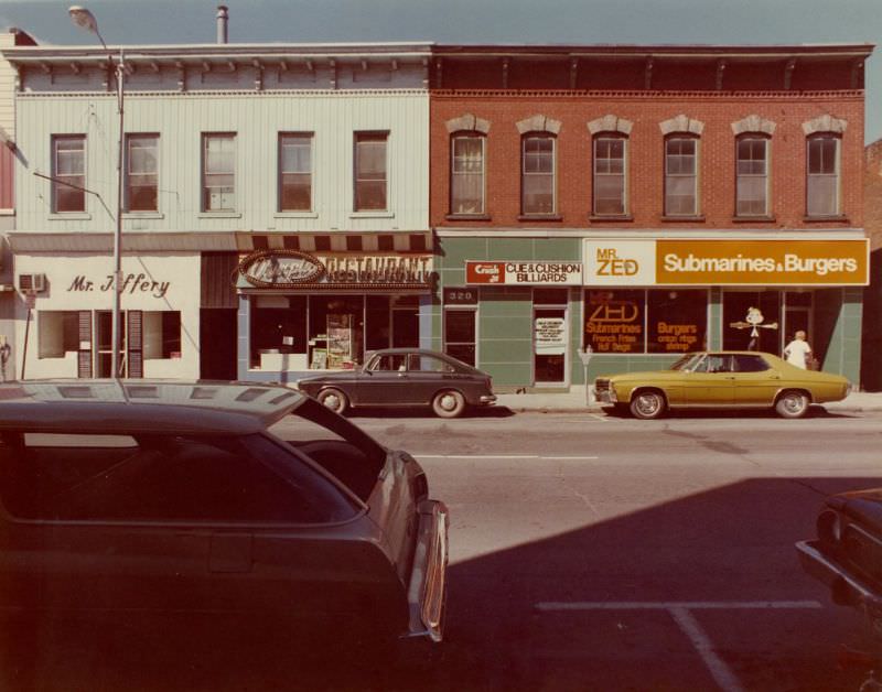 Mr Jeffery at 316, Olympia Restaurant at 318, Cue & Cushion Billiards at 320 and Mr Zed Submarines and Burgers at 324 Front Street, Belleville