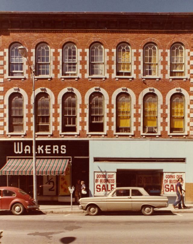 Walker's menswear store at 280 Front Street, Belleville, with the adjoining store advertising a 'Going Out of Business' sale (Harrison building)