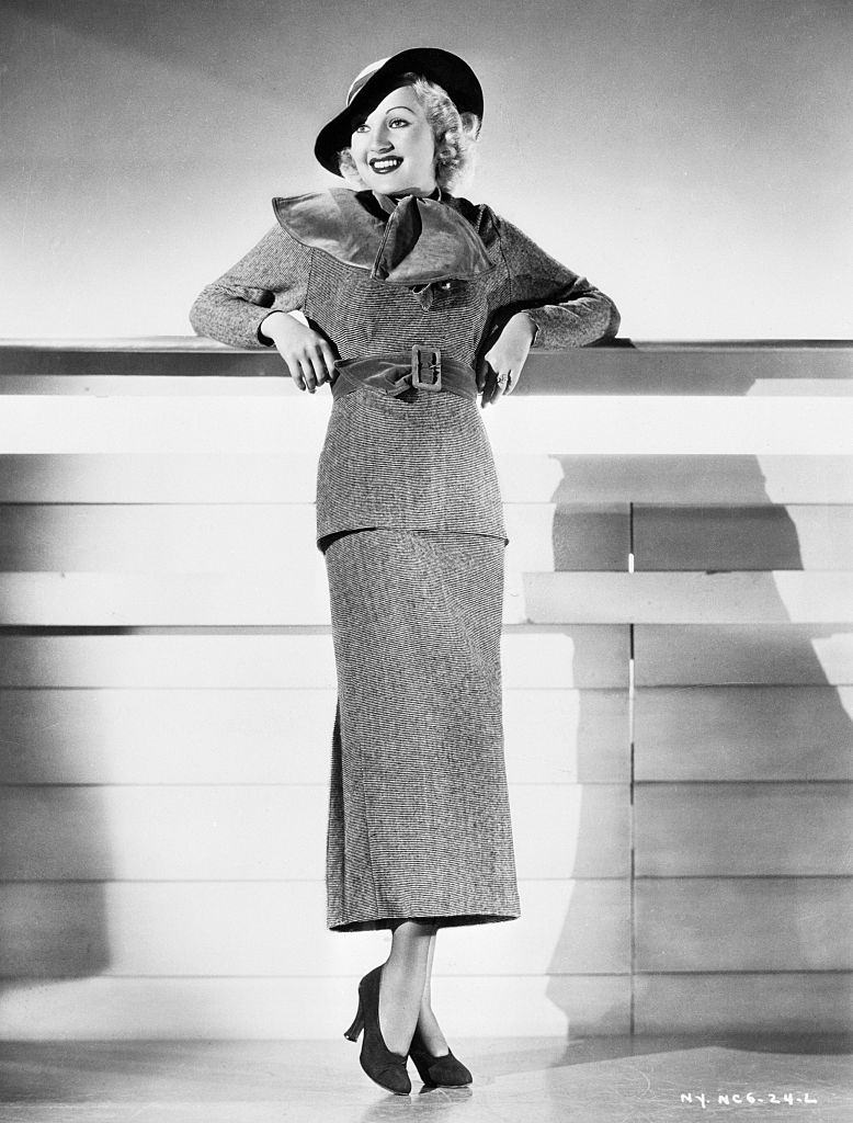 Betty Grable in wool sports dress in black and white pin stripes, 1934.