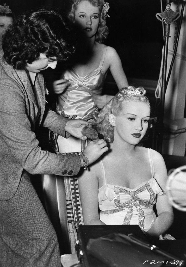 Betty Grable being prepared prior to filming a scene, 1938.