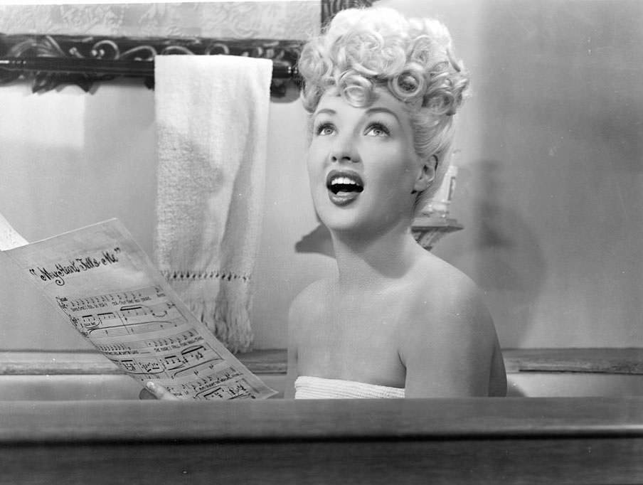 Betty Grable singing from bath tub in a scene from the film 'Sweet Rosie O'Grady', 1943.