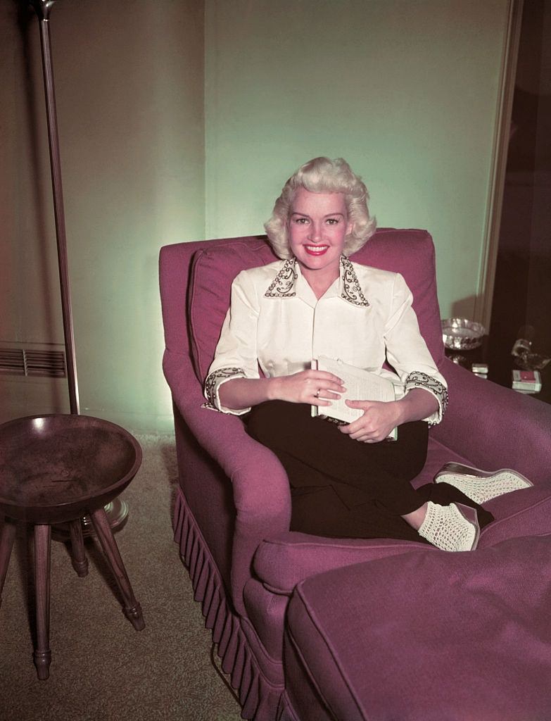 Betty Grable Sitting in Chair, 1950.