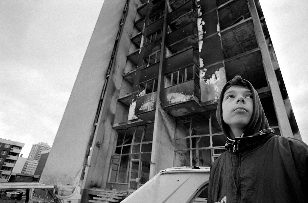 A boy in the area known as Heroes Square, so called because of the extreme dangers of living there during the war.