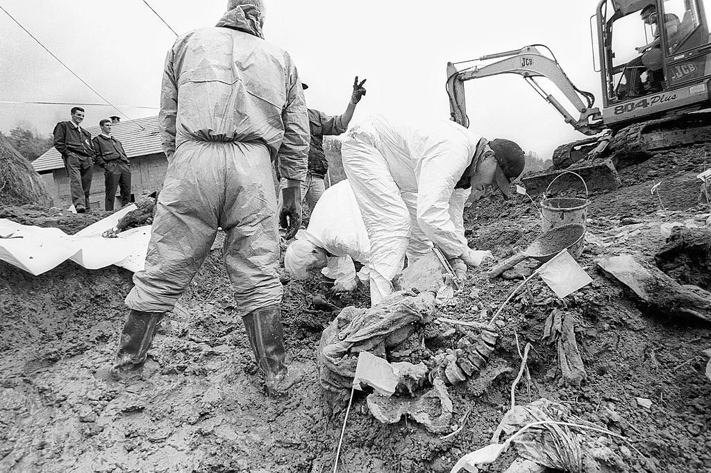 A mass grave containing the bodies of men massacred in Srebrenica in July 1995 that has been opened and the bodies are being exhumed by a team from the ICMP.