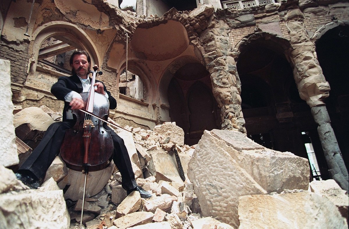 During the Bosnian War, cellist Vedran Smailovic plays Strauss inside the bombed-out National Library in Sarajevo, on September 12, 1992