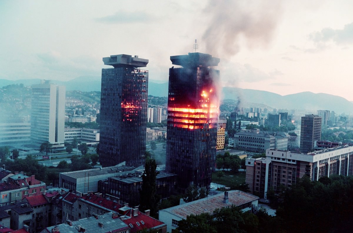 The "Momo" and "Uzeir" twin towers burn on Sniper Alley in downtown Sarajevo as heavy shelling and fighting raged throughout the Bosnian capital on June 08, 1992.