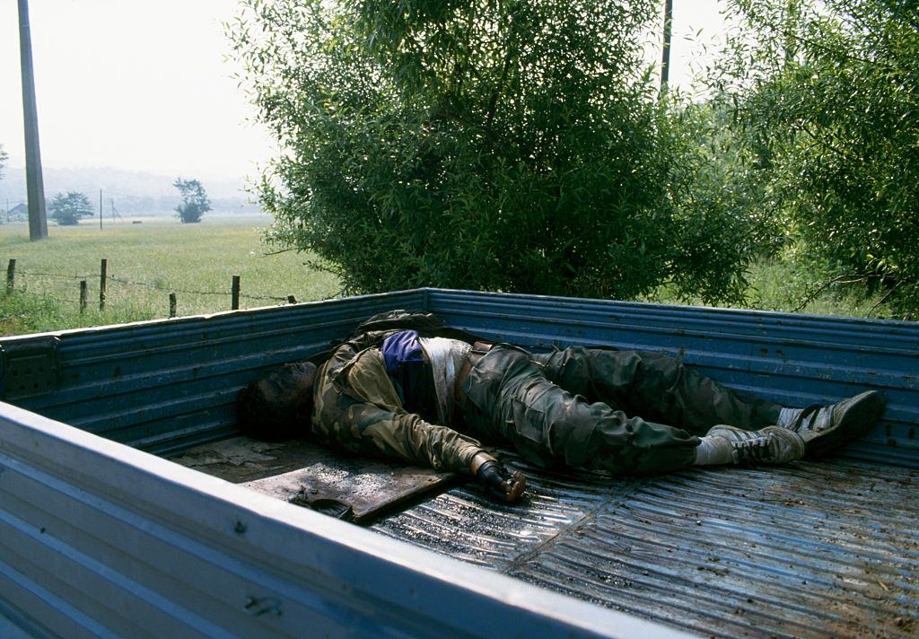 A pickup truck in Vitez carries the body of a Bosnian soldier killed during the Yugoslavian Civil War.
