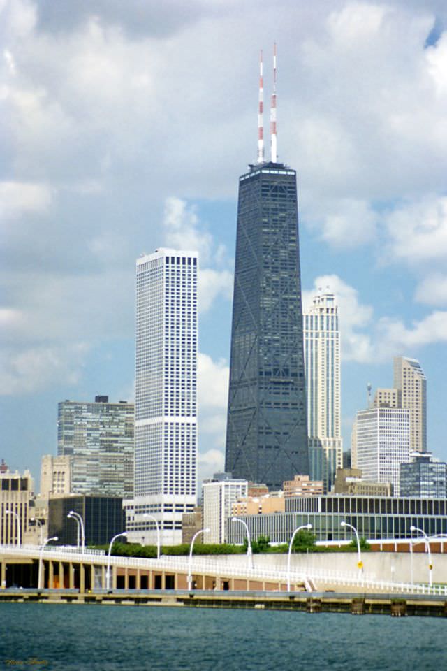 The Water Tower place is the white skyscraper and the John Hancock Center is the tall dark skyscraper, taken from Navy Pier, Chicago, July 1996
