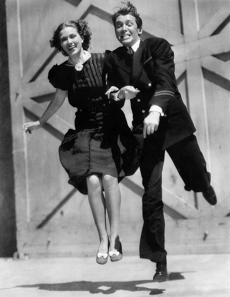 Eleanor Powell with James Stewart during a shooting break, 1937.