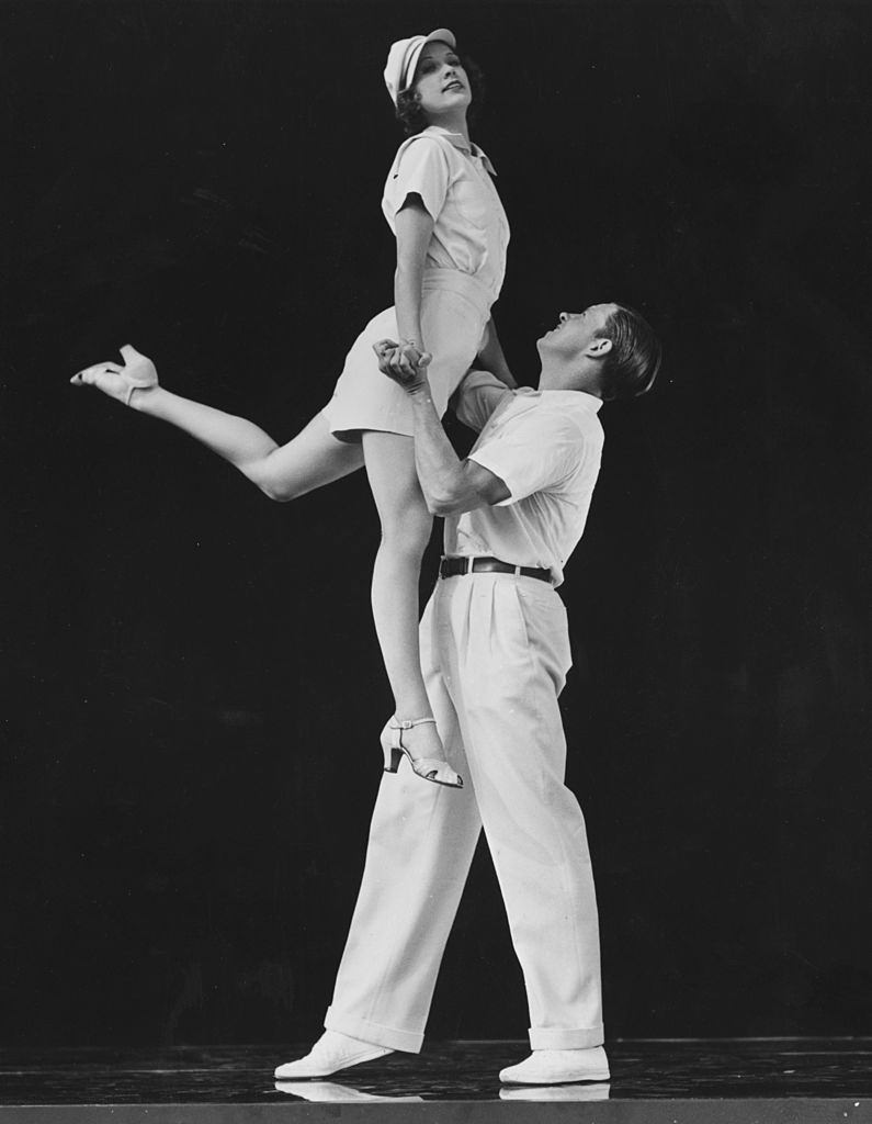 Eleanor Powell and George Murphy dancing in a scene from the MGM musical 'Broadway Melody of 1938'.