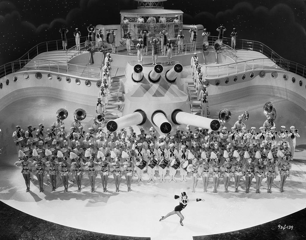 Eleanor Powell performs to the tune of a brass band on the deck of a ship in the musical 'Born To Dance', 1936.