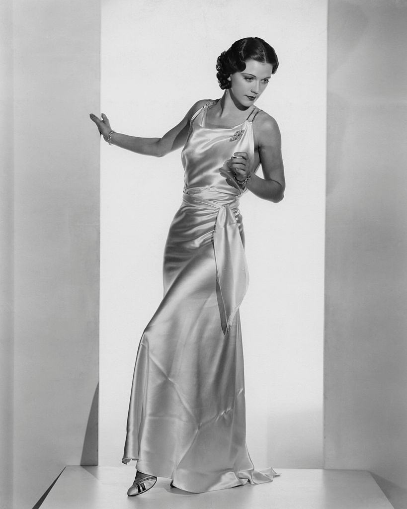 Eleanor Powell wearing a white satin formal gown, 1935.