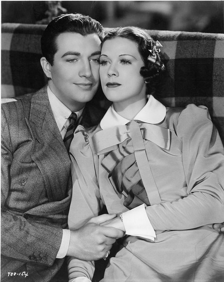 Eleanor Powell and Robert Taylor hold eachother in a scene from the film 'Broadway Melody Of 1936'.