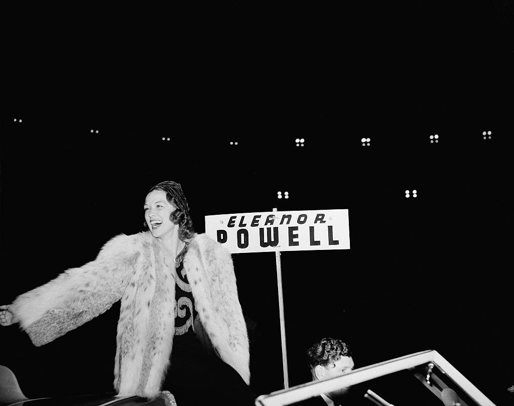 Eleanor Powell greets fans during the Hollywood Chirstmas Parade in Los Angeles, 1940.