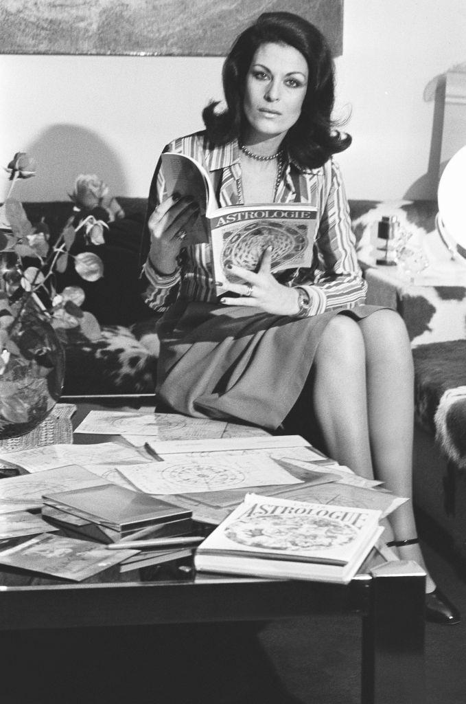 Elizabeth Teissier reading an astrology book, in February 1976.