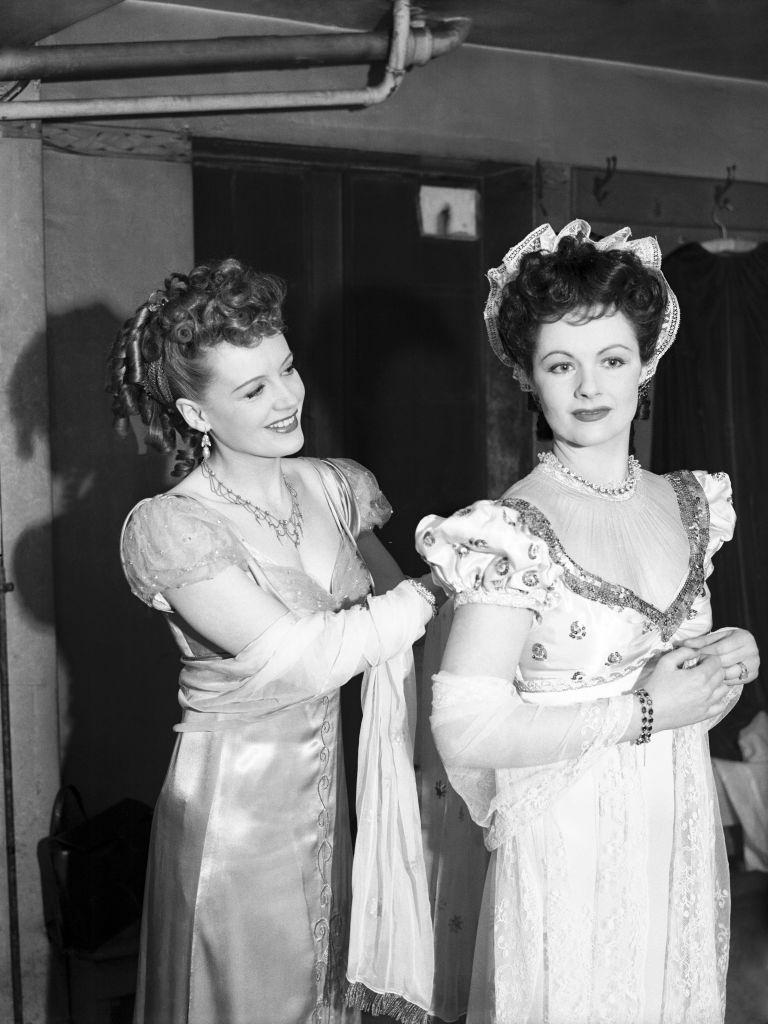 Phyllis Calvert and Margaret Lockwood putting finishing touches to their costumes before re-enacting their roles in "Man in Grey".