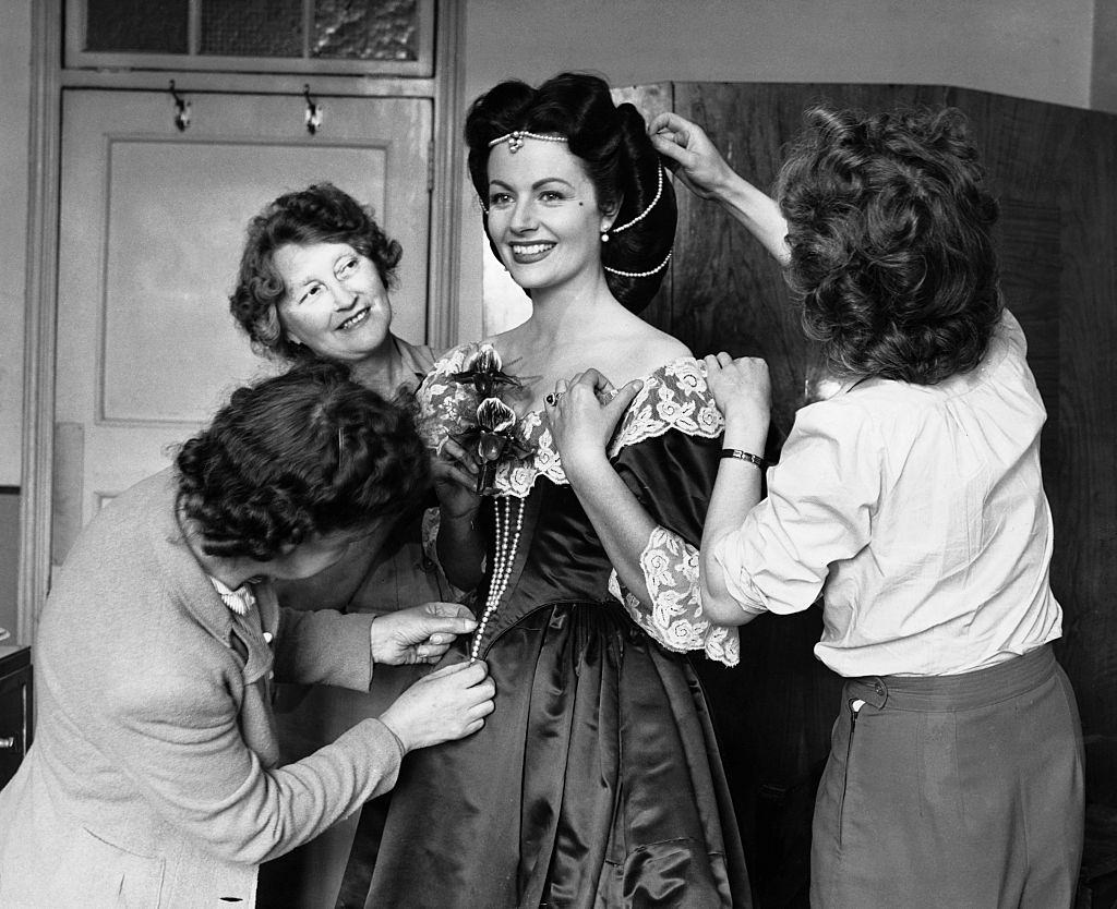 Margaret Lockwood undergoes a costume fitting during the remaking of 'The Wicked Lady', 1945.
