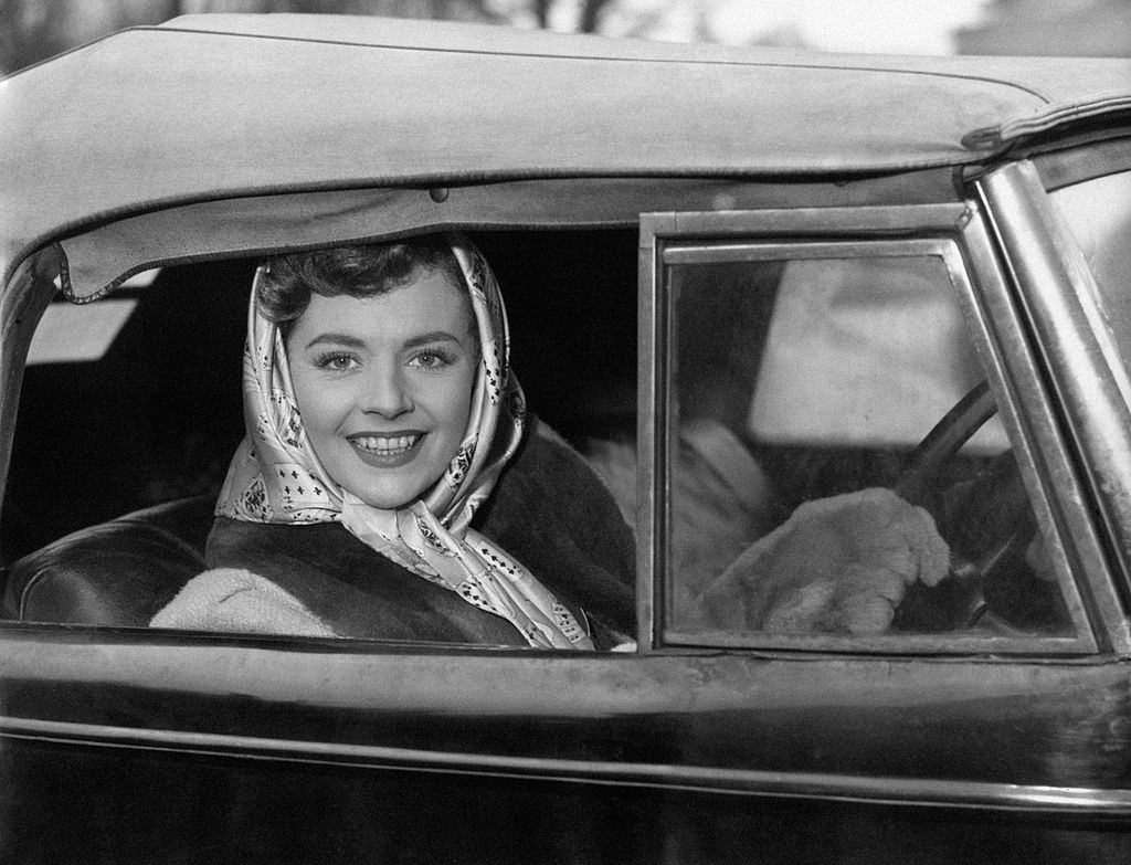 Margaret Lockwood reaching Denham Film Studios on board her convertible, 1949.