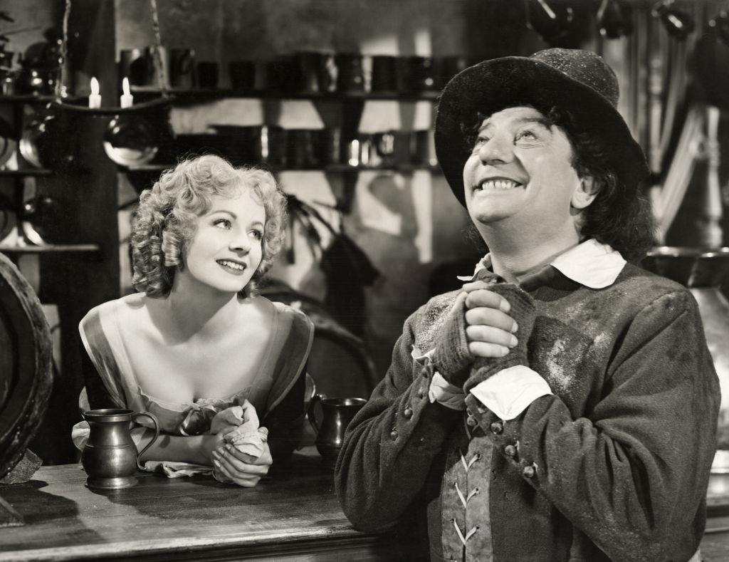 Margaret Lockwood with d Sid Field as a Cromwellian barrow-boy, in a scene from the film "Cardboard Cavalier", 1949.