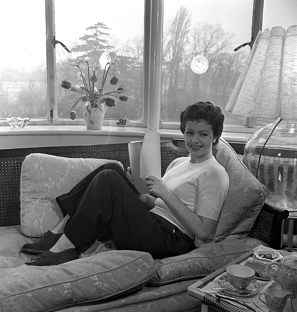Margaret Lockwood relaxing at her home, 1950.