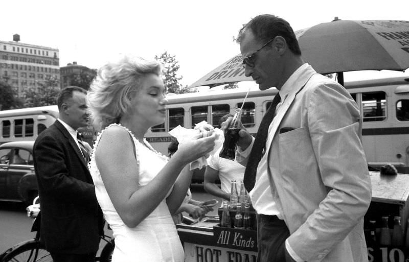 Marilyn Monroe and her Husband Arthur Miller eating Hot Dogs from a New York Street Stall, 1957