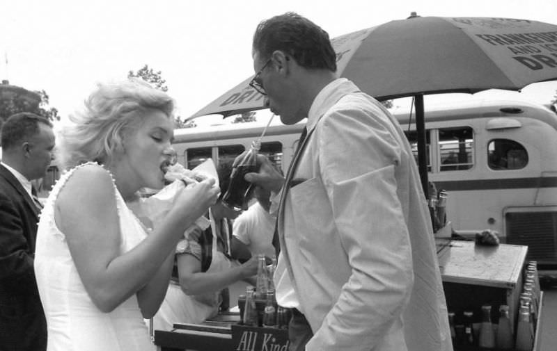 Marilyn Monroe and her Husband Arthur Miller eating Hot Dogs from a New York Street Stall, 1957