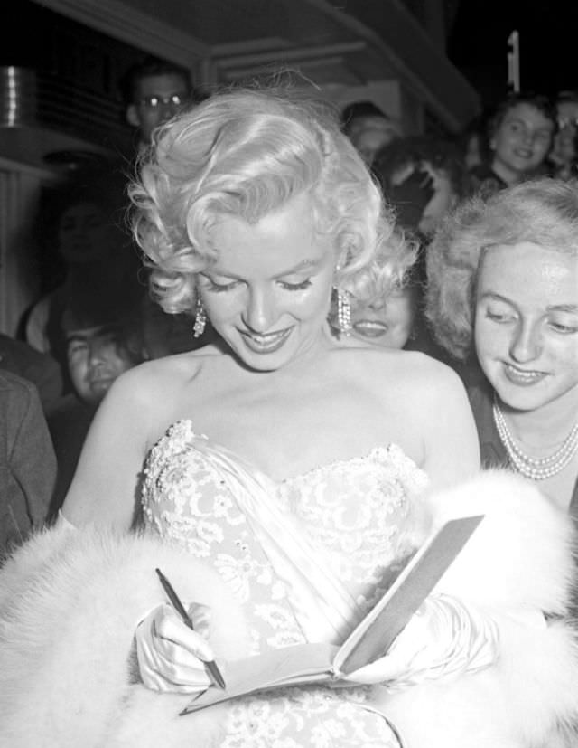 Marilyn Monroe signing autographs for her fans in a series of Candid Photographs