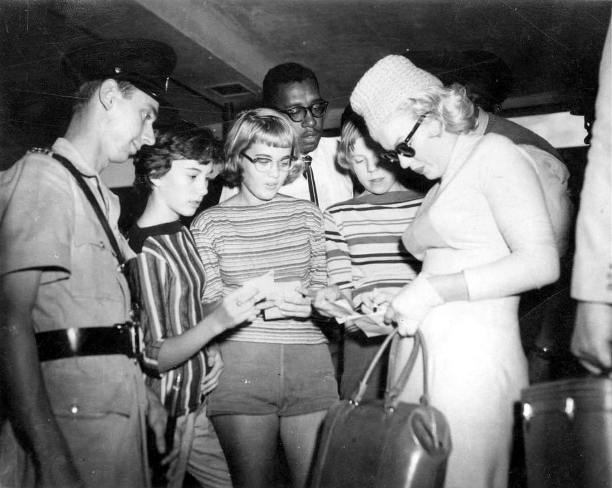 Marilyn Monroe signing autographs for her fans in a series of Candid Photographs