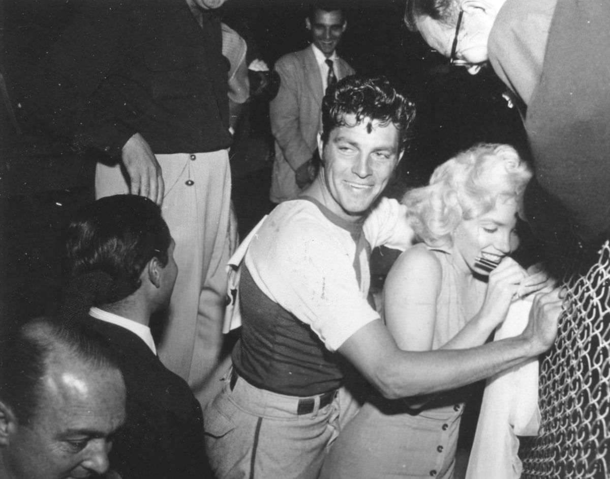 Marilyn Monroe signing autographs for her fans in a series of Candid Photographs