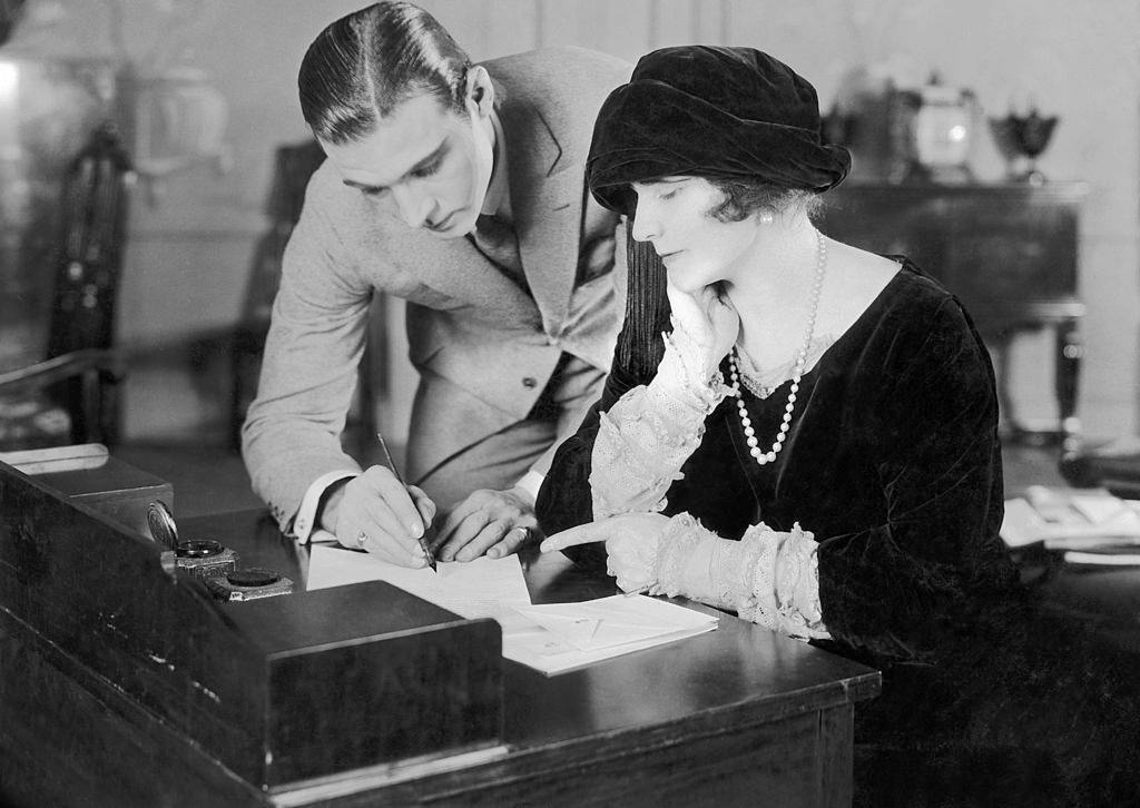 Rudolph Valentino and the actress Natache Rambova signing the register on their Wedding Day, 1923.