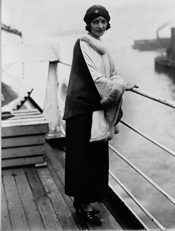 Natacha Rambova stands on the deck of the Paris as she sails to Europe on vacation. September 13, 1925.