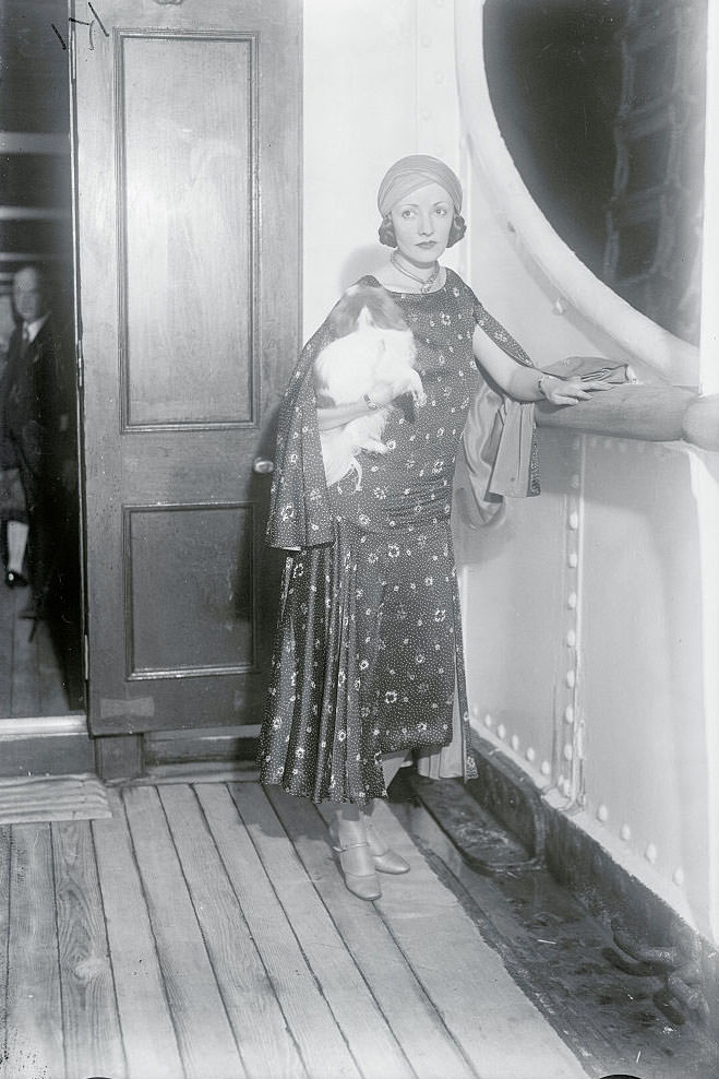 Natacha Rambova with her pet as she sailed on the S.S. Aquitania for Europe, 1929.