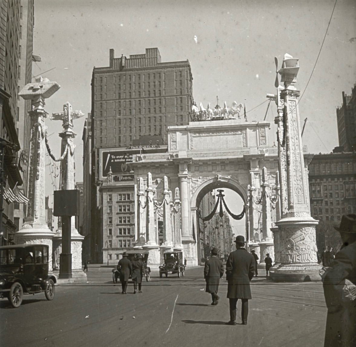 This Victory Arch, a temporary structure erected just to the west of Madison Square Park, at the intersection of Broadway and Fifth Avenue, where the crowd surged into the streets to greet the marchers.